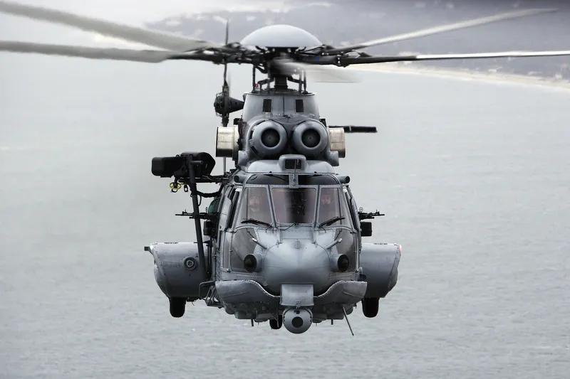 Military helicopter over water
