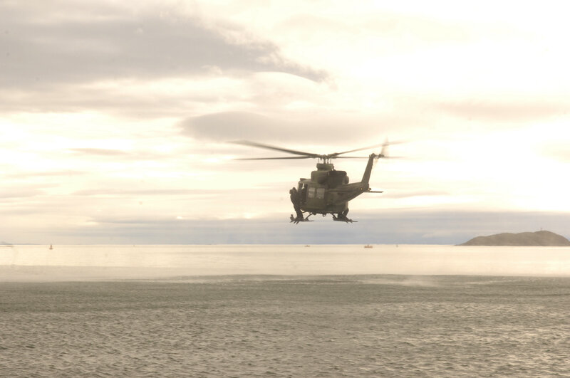 Military helicopter over water