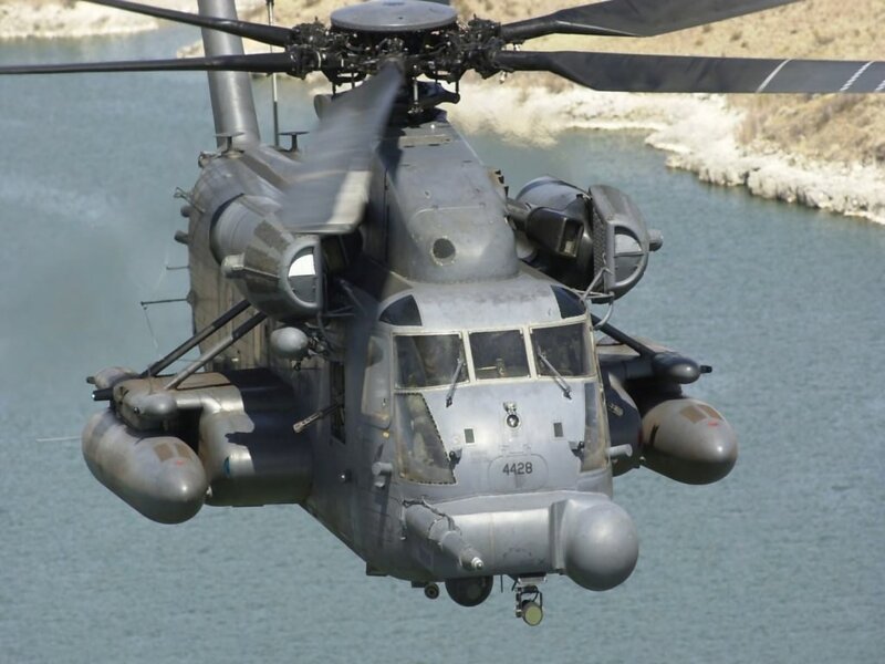 Military helicopter over water