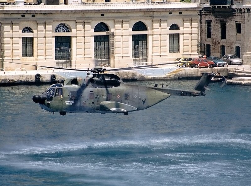 Military helicopter over water