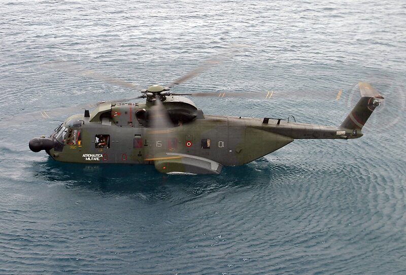 Military helicopter over water