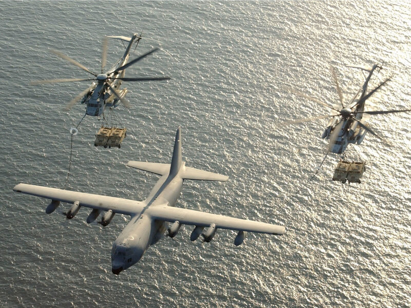 Military helicopters and cargo plane