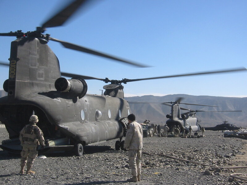 Military helicopters at a desert base