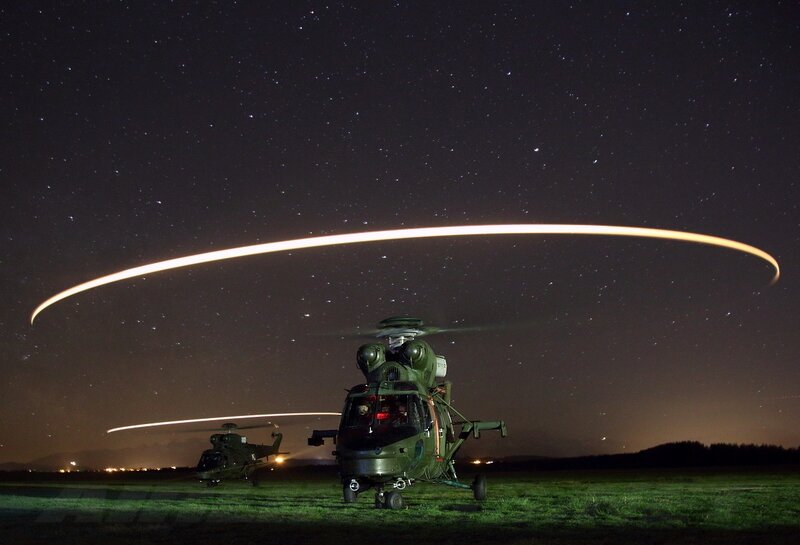 Military Helicopters at Night — Green