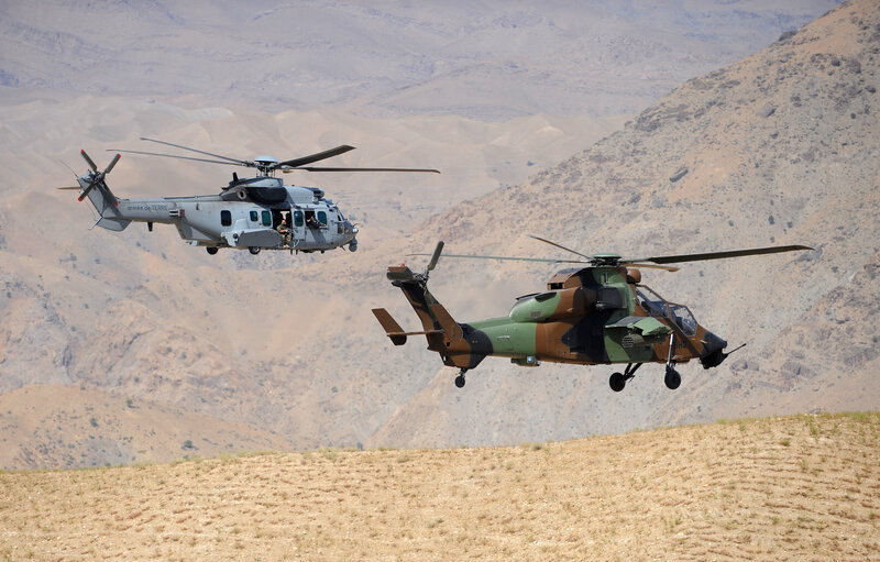 Military helicopters in desert flight