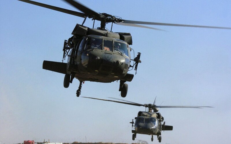 Military helicopters in flight