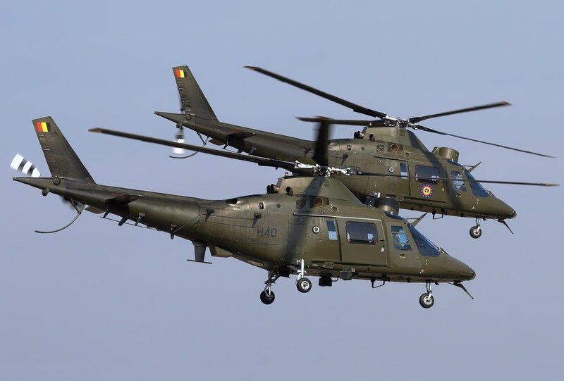 Military Helicopters in Flight — Green, Dynamic, Afternoon, Photograph, Sky, Wheels
