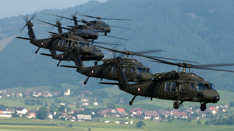 Military helicopters in formation