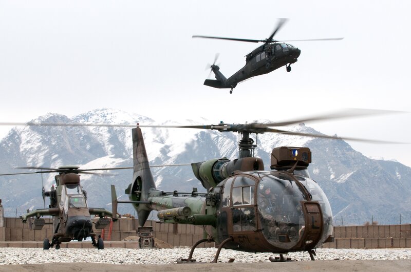Military helicopters in mountainous region