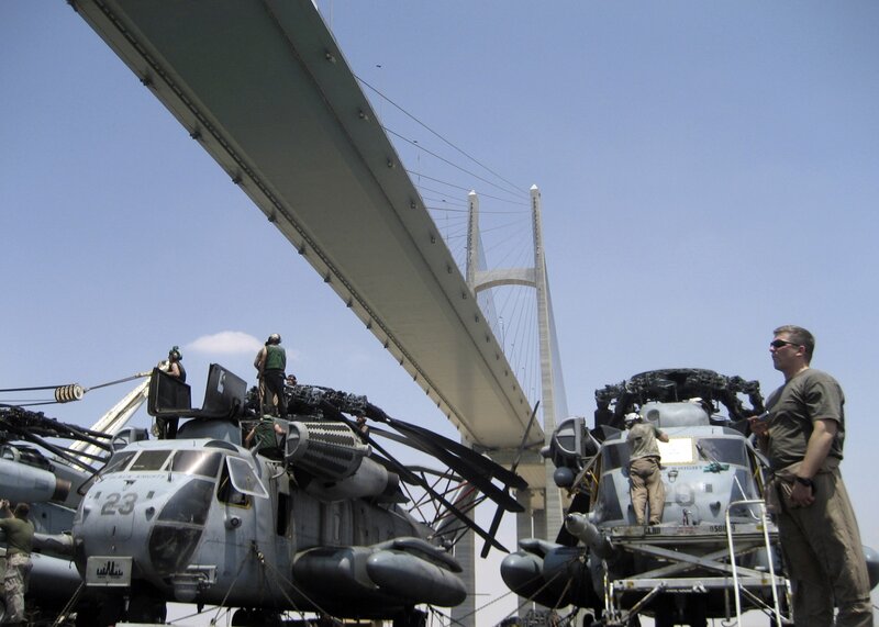 Military helicopters on a bridge