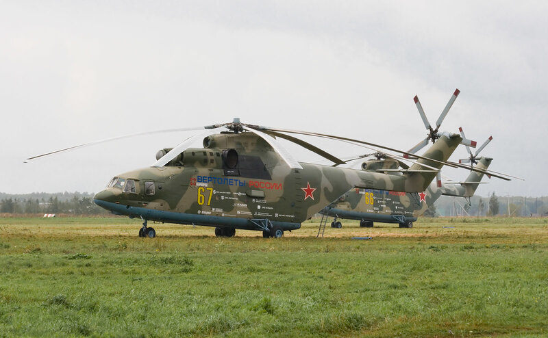 Military helicopters on a field