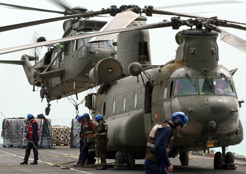 Military helicopters on aircraft carrier deck