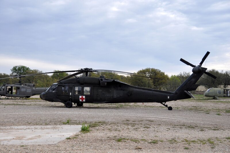 Military helicopters on airfield
