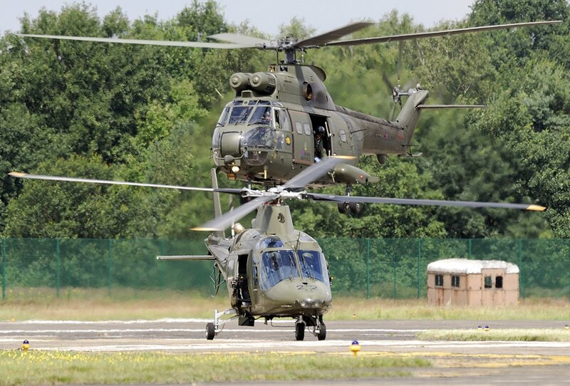 Military helicopters on airfield