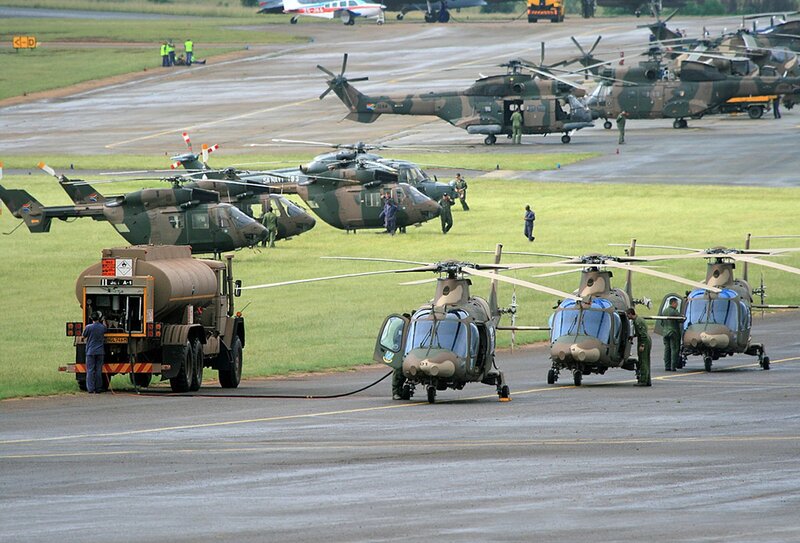 Military helicopters on airfield