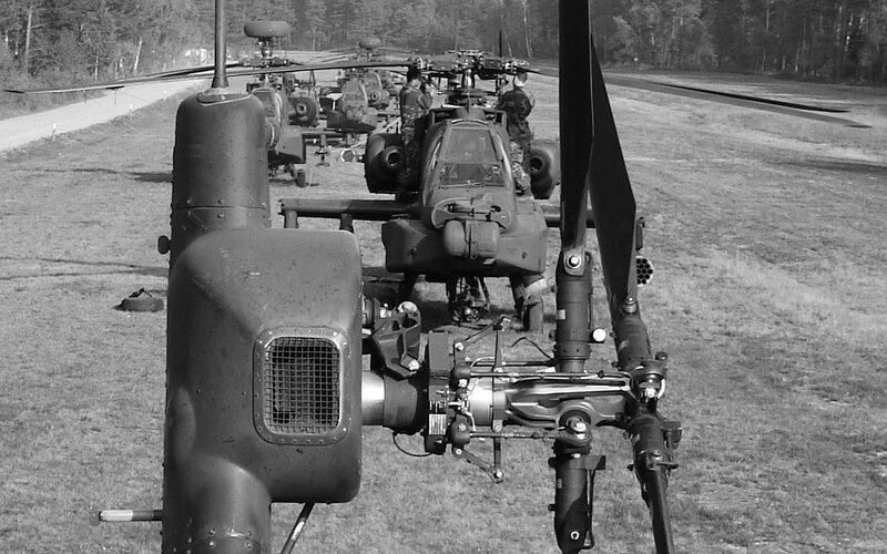 Military helicopters on airfield