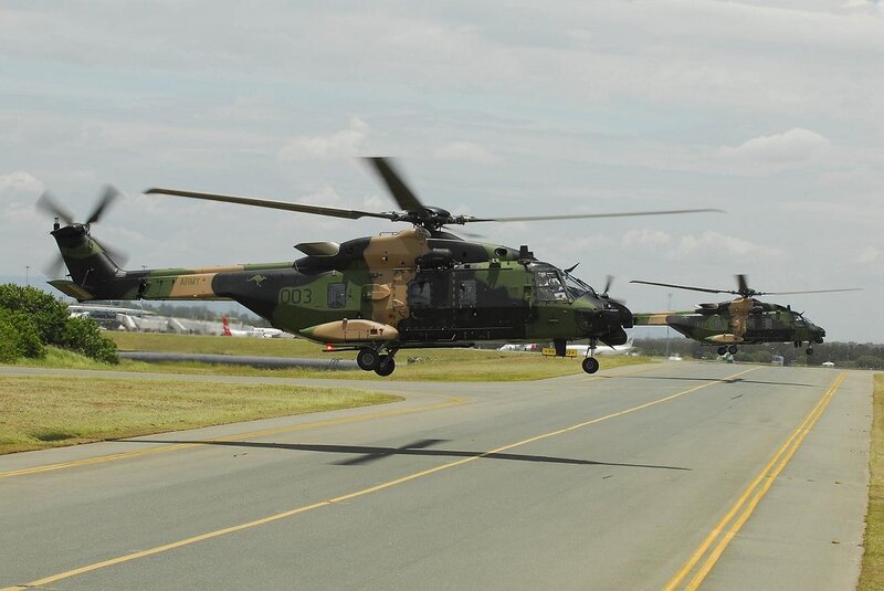 Military helicopters on runway