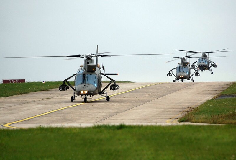 Military helicopters on runway