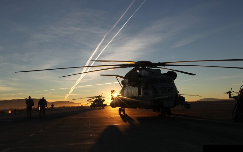Military Helicopters on Tarmac — Blue