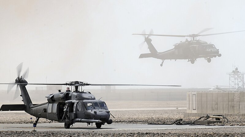 Military Helicopters on Tarmac — Gray, Hazy