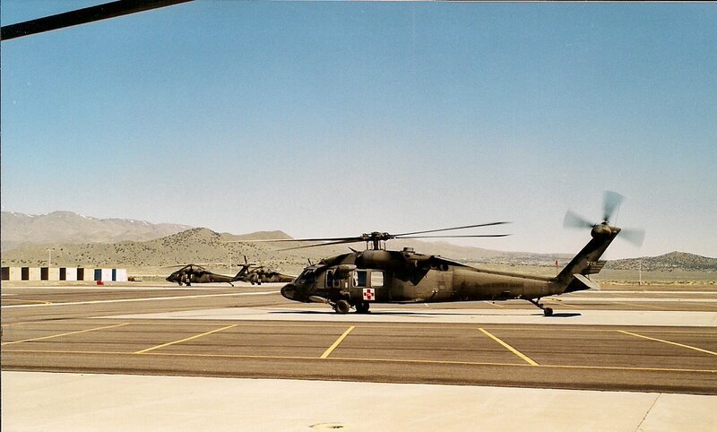Military Helicopters on Tarmac — Green