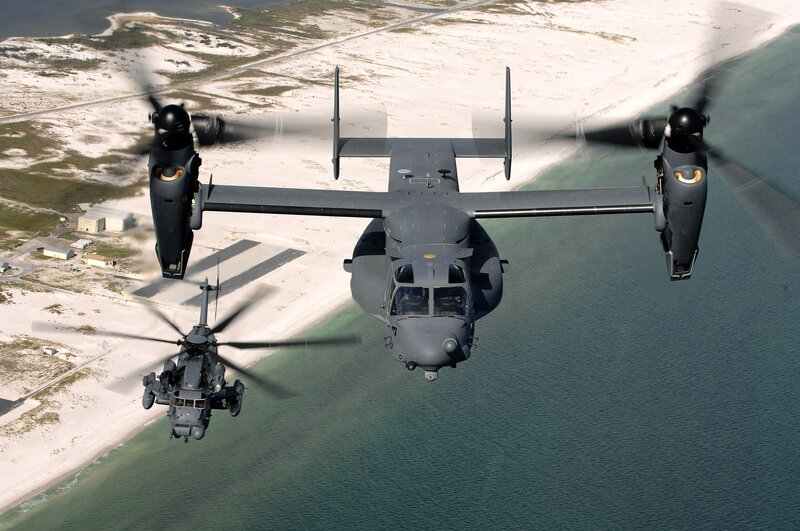 Military helicopters over coastline