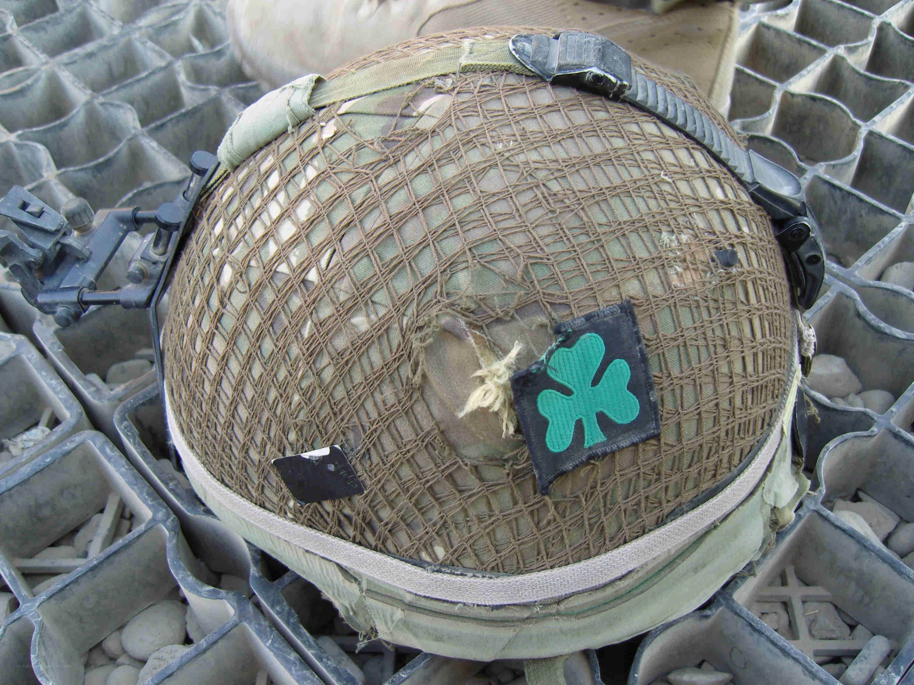 military helmet with shamrock patch