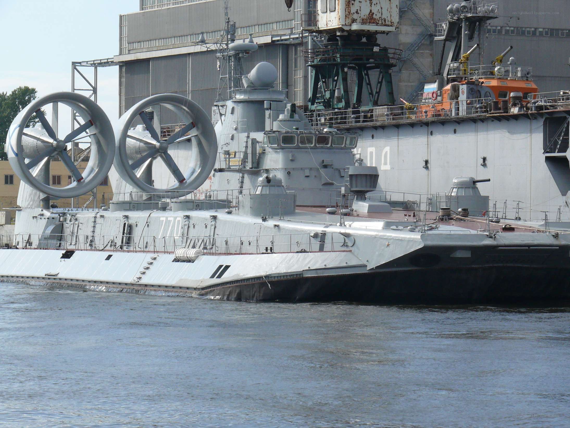 Military hovercraft at dock