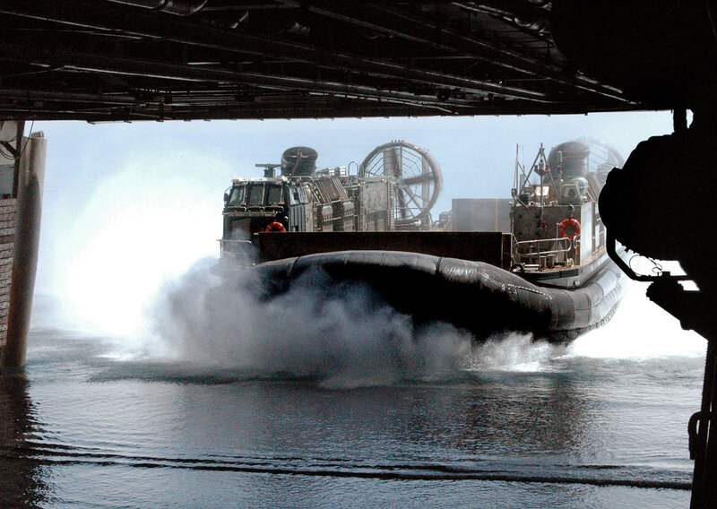 Military hovercraft in water