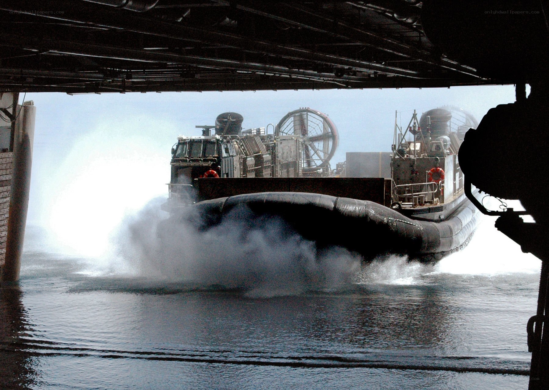 Military hovercraft in water
