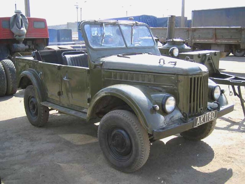 Military jeep in a yard