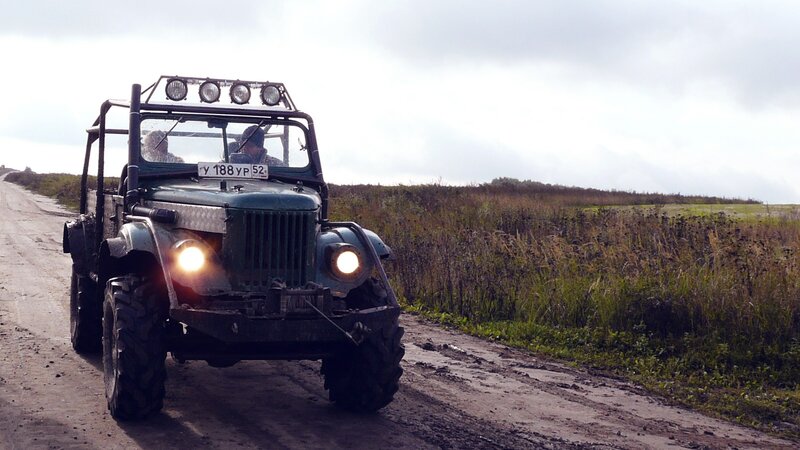 Military jeep on dirt road