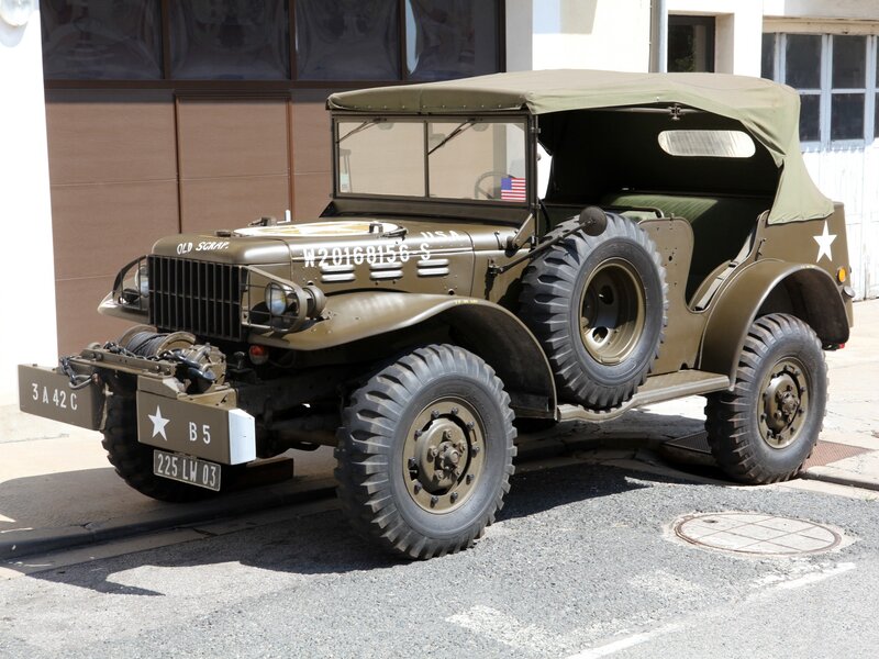 Military jeep parked on street