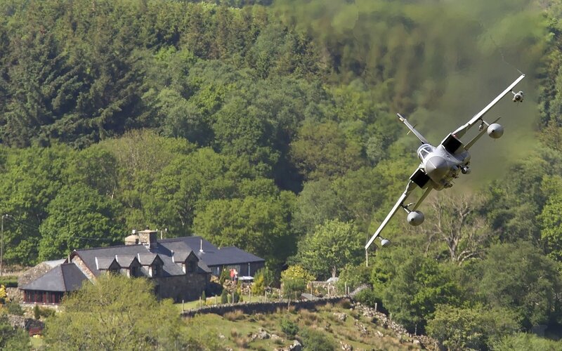 Military Jet Flying Low — Green, Dramatic