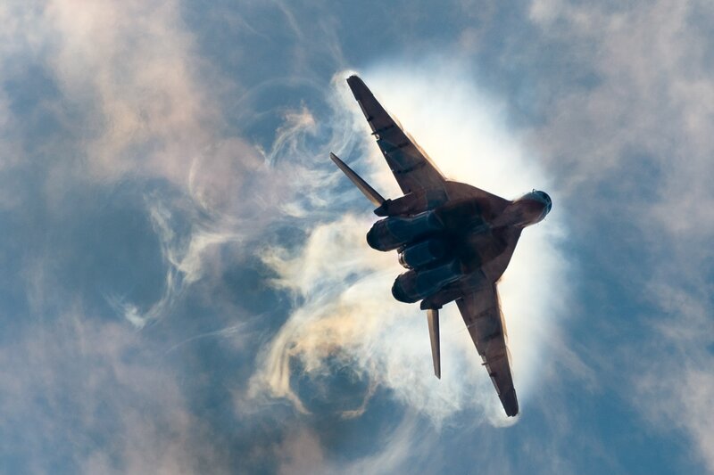 Military Jet in Flight — Blue, Dramatic, Photograph, Clouds