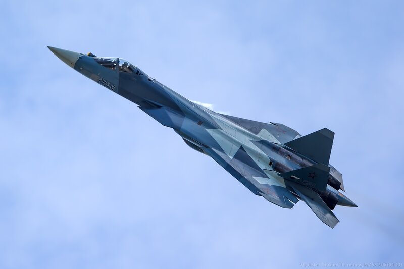 Military Jet in Flight — Blue, Dynamic, Afternoon, Photograph, Sky, Aircraft, Pilot