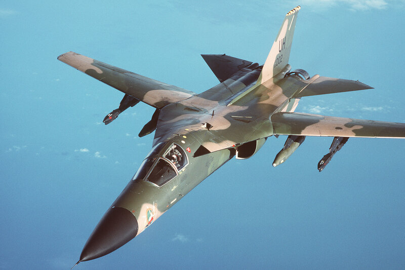 Military Jet in Flight — Blue, Dynamic, Photograph, Aircraft, Sky, Missiles