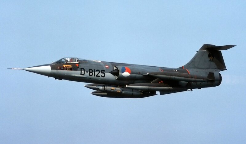 Military Jet in Flight — Gray, Calm, Afternoon