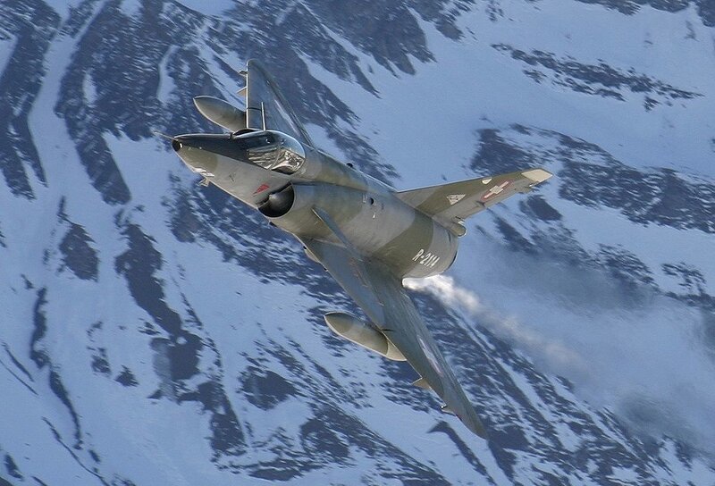 Military Jet in Flight — Gray, Dramatic, Winter