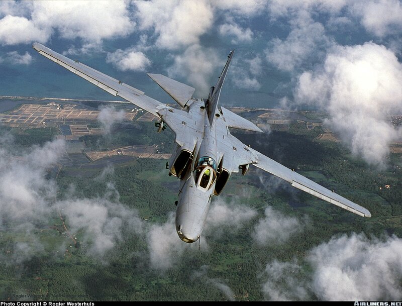 Military Jet in Flight — Gray, Dynamic, Afternoon, Photograph, Aircraft, Clouds