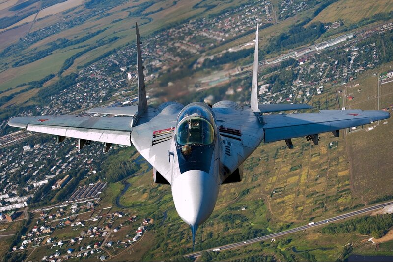Military Jet in Flight — Gray, Dynamic, Afternoon, Photograph, Aircraft, Town