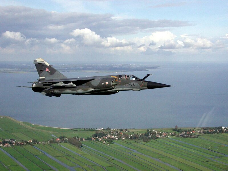 Military Jet in Flight — Green, Calm, Afternoon