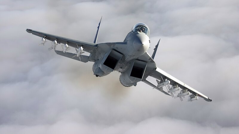 Military Jet in Flight — Missiles