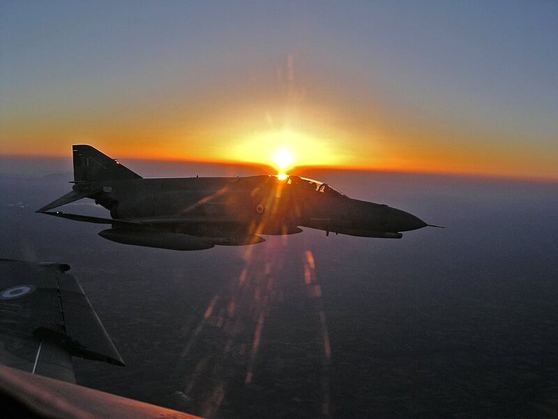 Military Jet in Flight — Orange, Dramatic