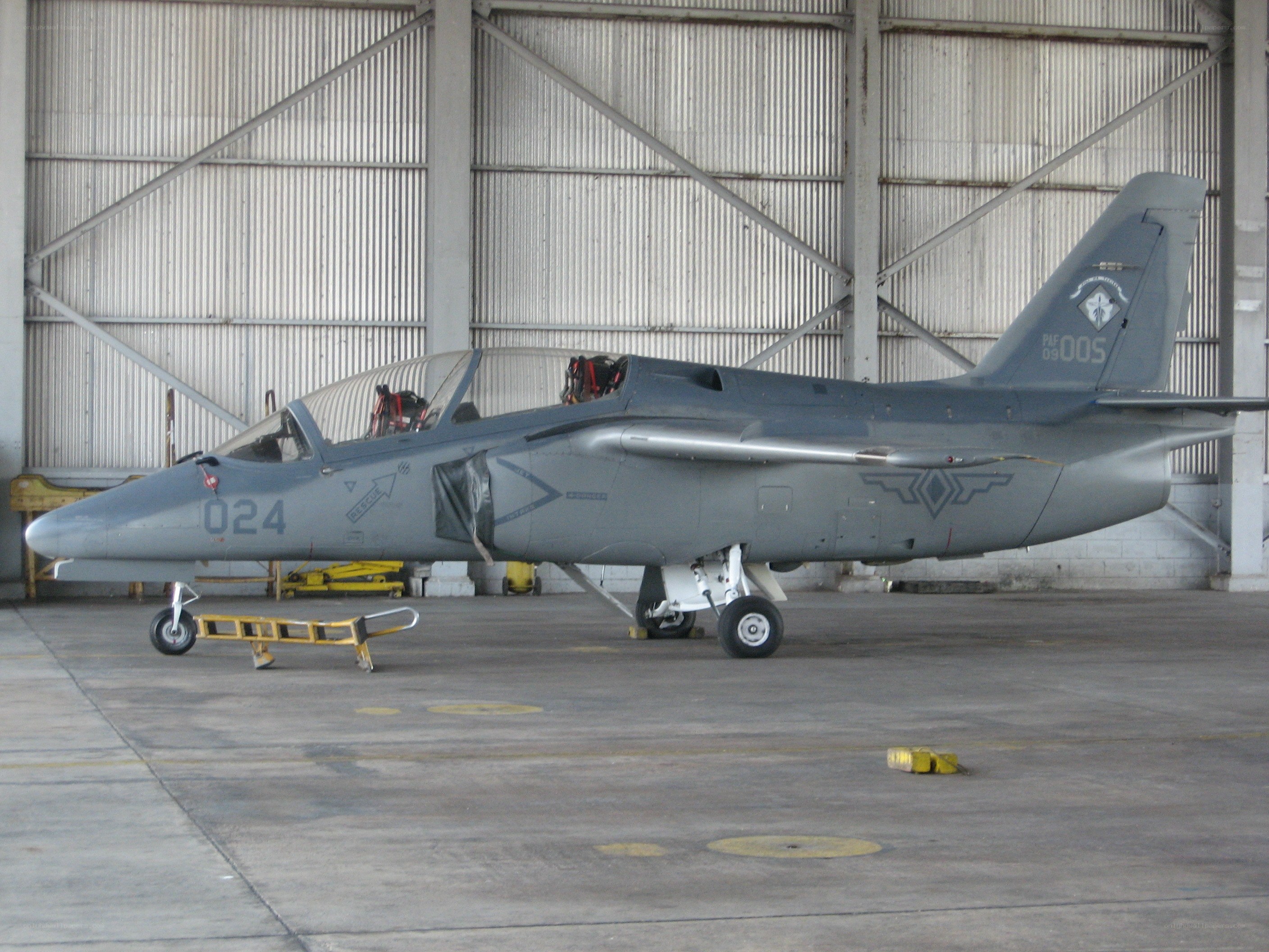 military jet in hangar
