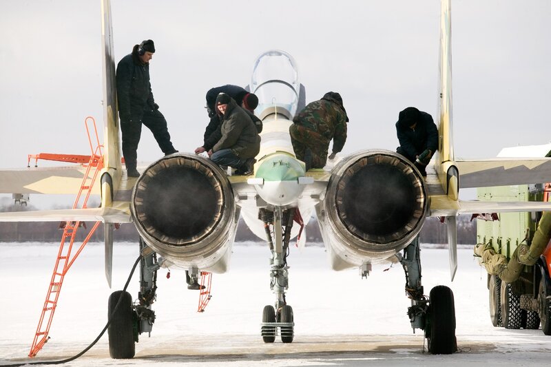 Military jet maintenance in winter