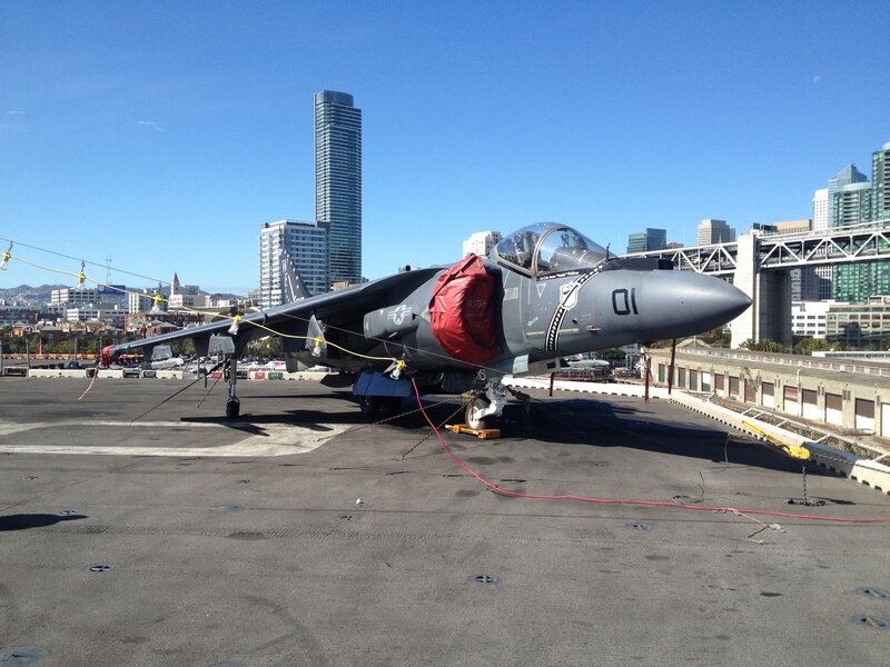 Military jet on aircraft carrier deck