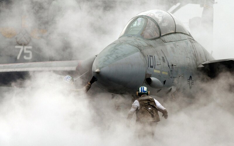 Military Jet on Aircraft Carrier — Gray, Dramatic
