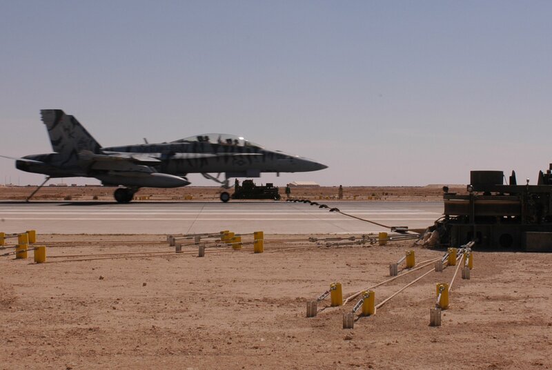 Military jet on desert tarmac