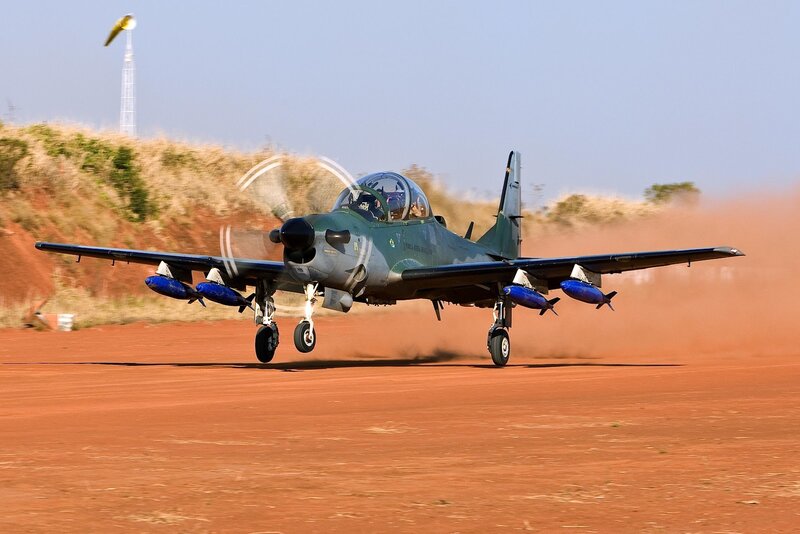 military jet on dirt runway
